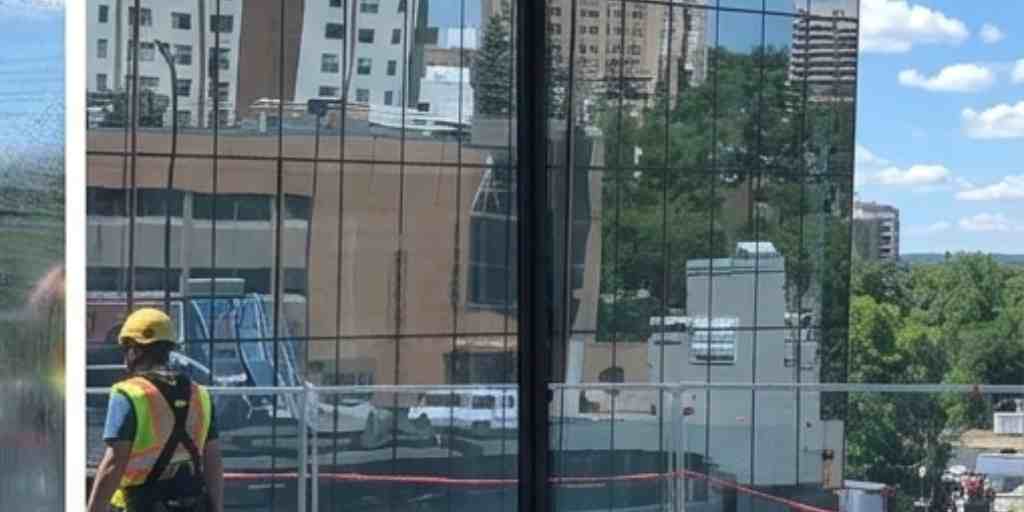 After – high-rise office building glass panel cleaned streak-free