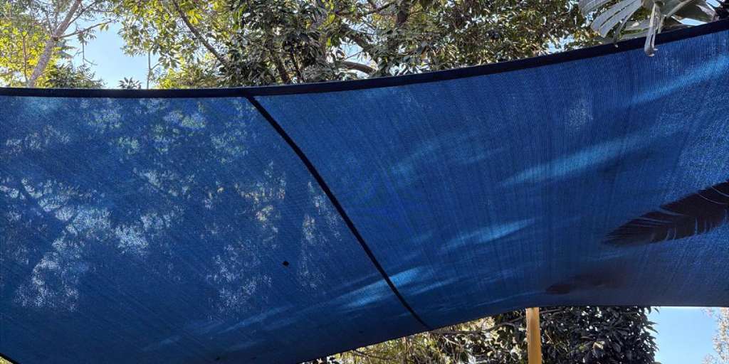 After – blue outdoor park shade sail cleaned and mould treated