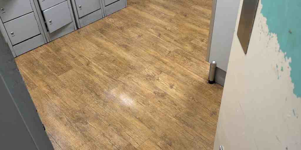 After – staff locker room vinyl plank floor restored